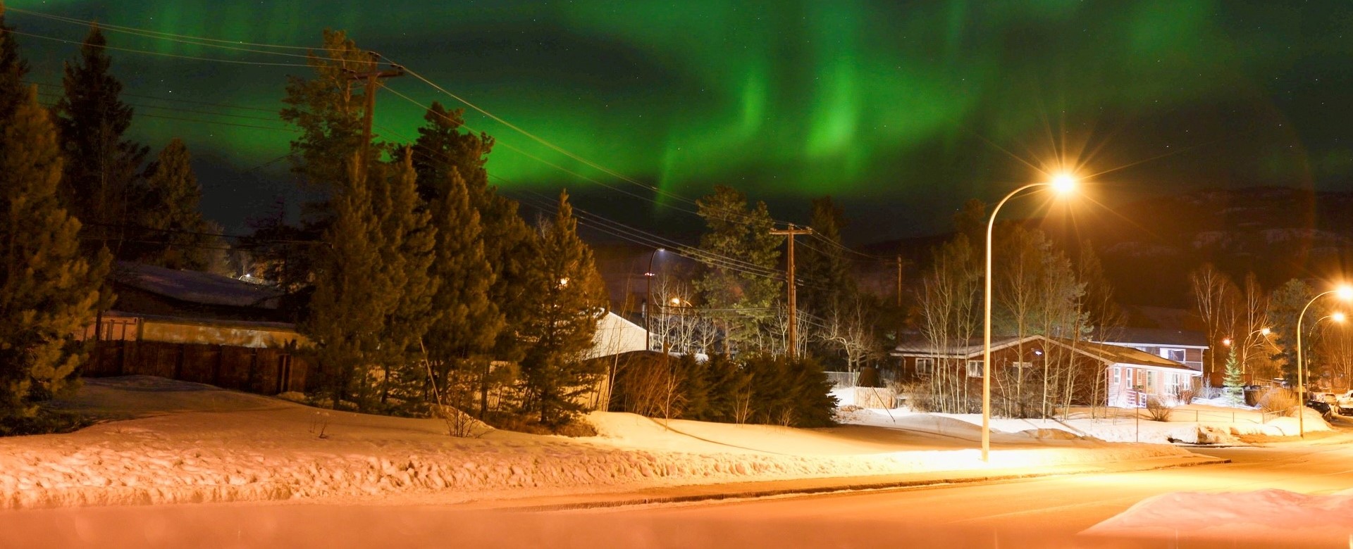Aurora borealis over neighbourhood in Whitehorse, Yukon